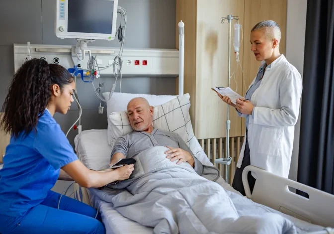 Medical staff attending to an elderly patient